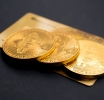 Gold prices showed mixed trading amid rising US dollar